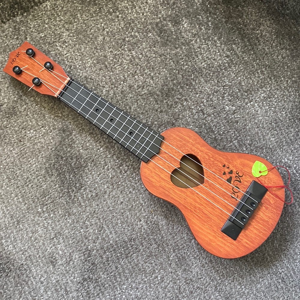 Ukulele. Kids toy. Does NOT tune.